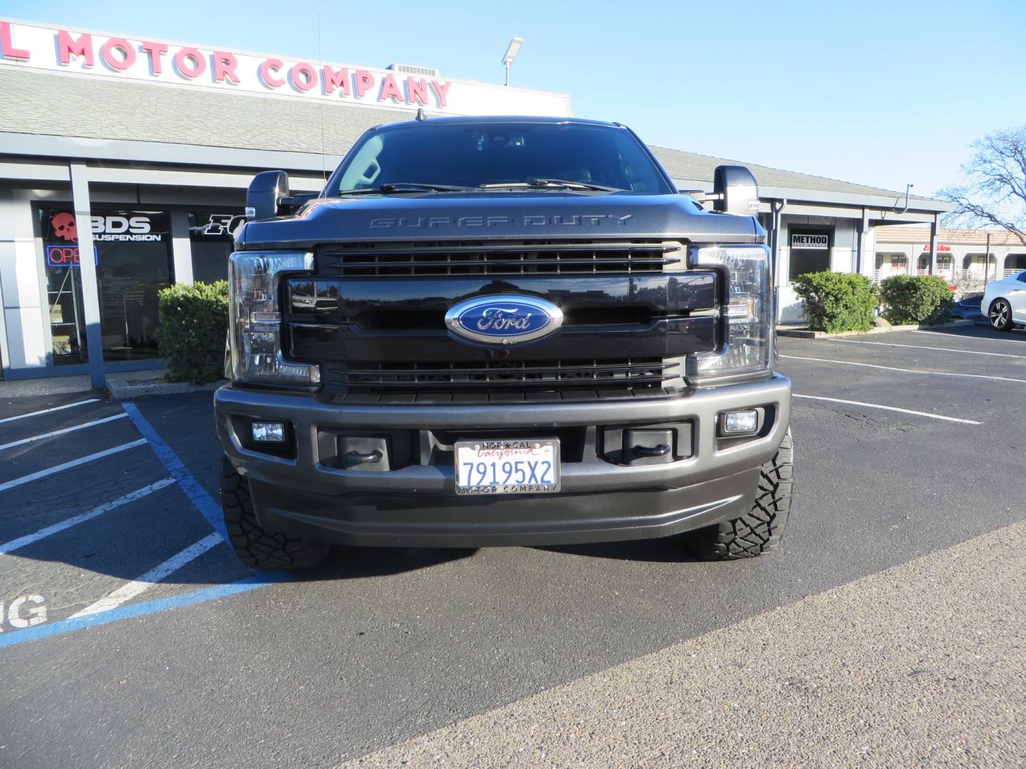 2019 CHARCOAL /BLACK Ford F-350 SD Lariat Crew Cab 4WD (1FT8W3BT7KE) with an 6.7L V8 OHV 16V DIESEL engine, 6A transmission, located at 2630 Grass Valley Highway, Auburn, CA, 95603, (530) 508-5100, 38.937893, -121.095482 - Leveled Superduty sitting on 20" XD series wheels, 35" Nitto Ridge Grappler tires, window tint, and has Firestone Air bags. - Photo#1